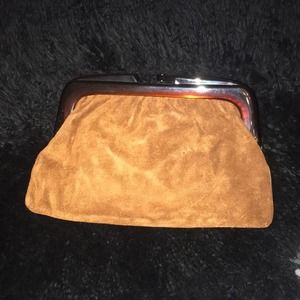 Hudson’s vintage brown suede clutch made Italy